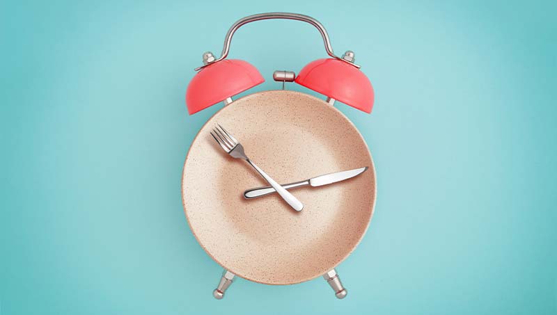 fasting concept of plate and clock